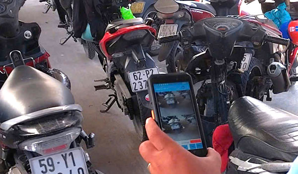 Máy in nhiệt tích hợp trên máy giữ xe cầm tay